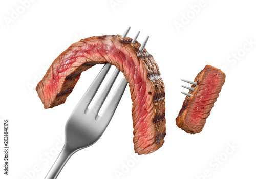 Grilled beef steak slices pierced by a metal fork against a solid black background, showcasing the red medium-rare interior and charred