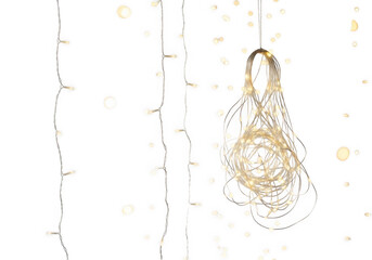 Hanging led fairy lights with a tangled bundle of glowing white bulbs against a solid black background, vertical light strands