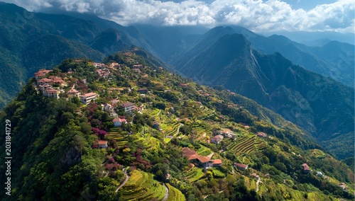 Breathtaking aerial view of a village nestled in the mountains.
