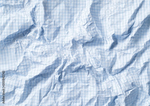 Crumpled graph paper texture with blue grid lines and shadows.