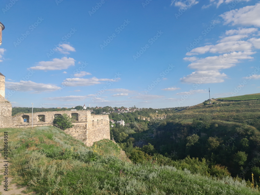 Fototapeta premium stone fortress wall under blue sky