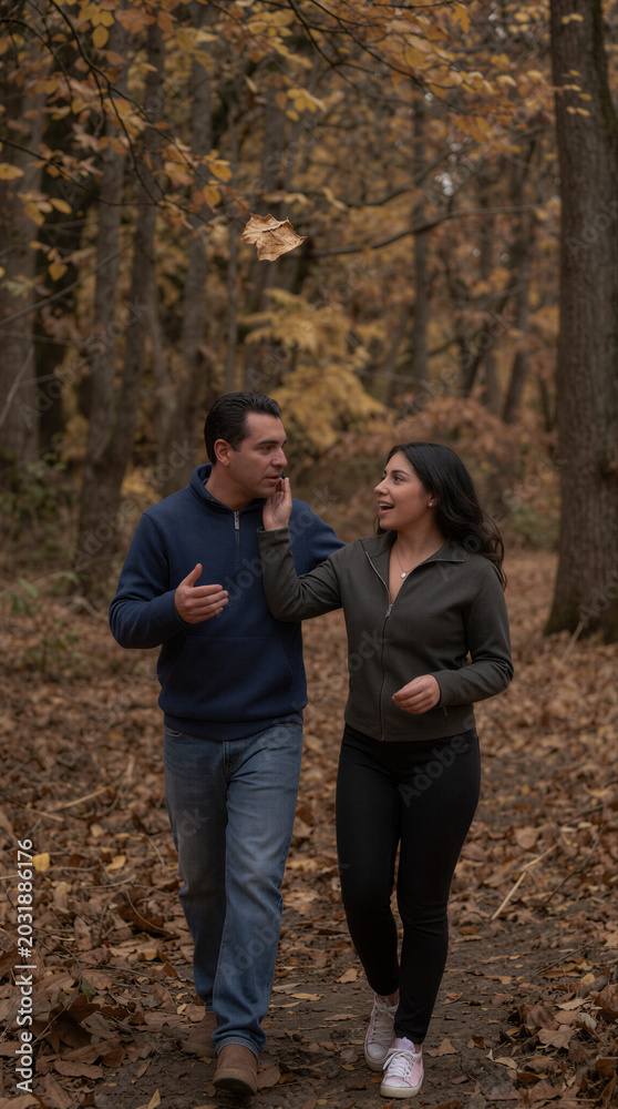 Fototapeta premium Two people walking outside in Autumn 