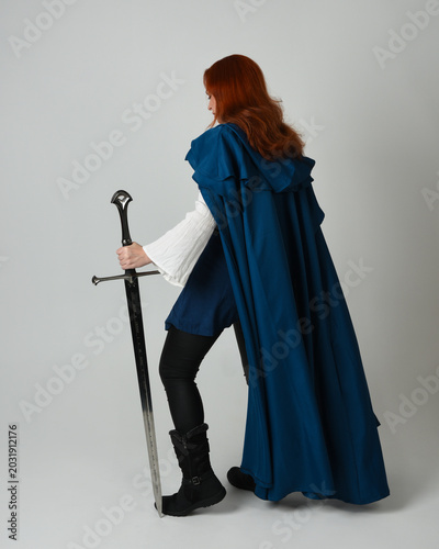 Quadro em tela full length portrait of female red head model wearing medieval fantasy warrior historical costume with blue cloak