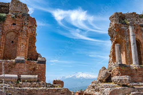 Taormina Teatro Antico with volcano Etna in the background