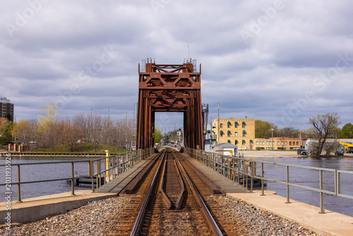 Bild auf Leinwand A Railroad Bascule Drawbridge Crossing A River.