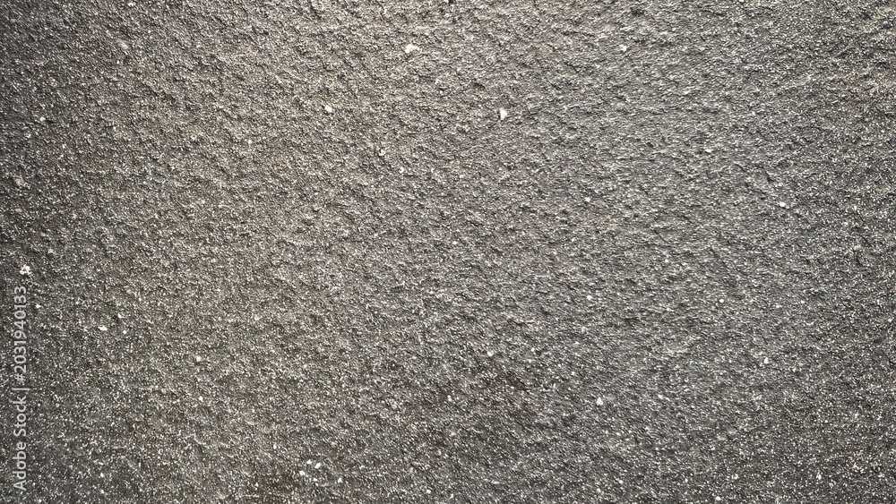 Fototapeta premium Rough gray textured surface, ideal for a minimalist desktop wallpaper.