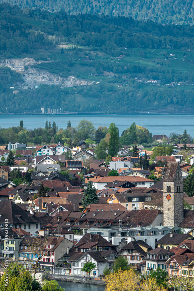 Fototapeta premium Panoramic view of Interlaken town with church tower and alpine landscape, Switzerland.