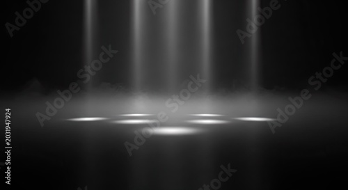 Dramatic light beams descending on illuminated spots in dark environment