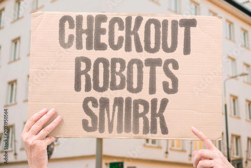 Foto "Checkout Robots Smirk" Machines now greet shoppers while exhausted cashiers quietly disappear everywhere