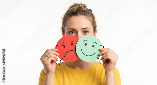 Woman with Bipolar Disorder Holding Red Sad and Green Happy Paper Smiley Masks Showing Mood Swings and Emotional Changes Mental Health Concept