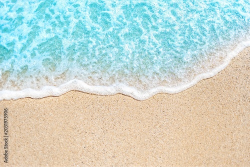 Slika na platnu Tropical sandy beach shoreline with gentle turquoise waves lapping at golden san