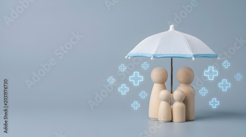 Wooden family figures under umbrella representing health insurance coverage protection