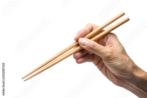 Hand Holding Wooden Chopsticks Isolated on White Background