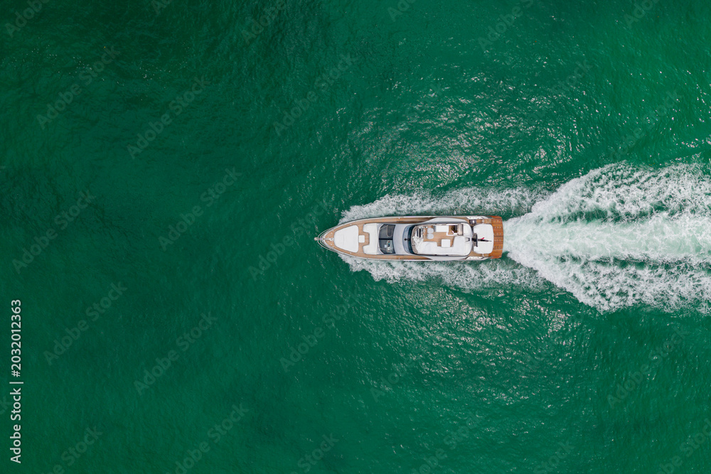 Fototapeta premium Yacht luxury view at sea. Vacation on summer. Summertime motorboat tour. Luxury motor boat yacht. Yacht go to marina. Boating and yachting. Luxury lifestyle. Marina yacht club