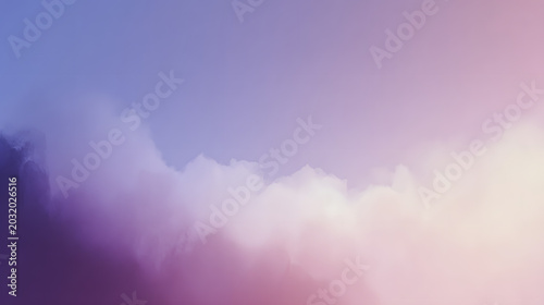 Soft clouds drift across a vibrant purple and pink gradient sky in this beautiful artistic photograph of the atmosphere above