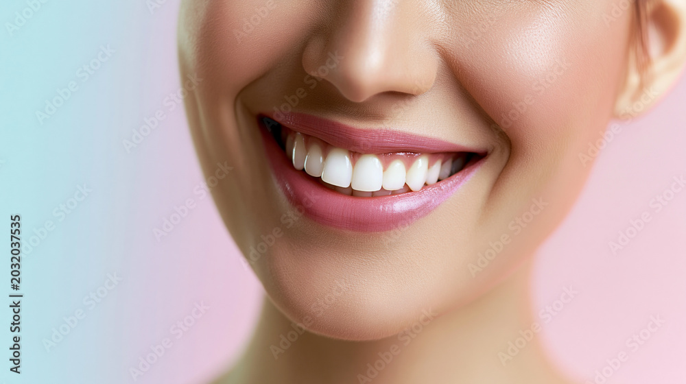 Fototapeta premium Bright natural smile of a woman with white teeth and smooth skin representing dental health and beauty care.