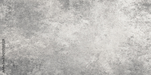Grey concrete wall texture with rough and weathered surface for background and design