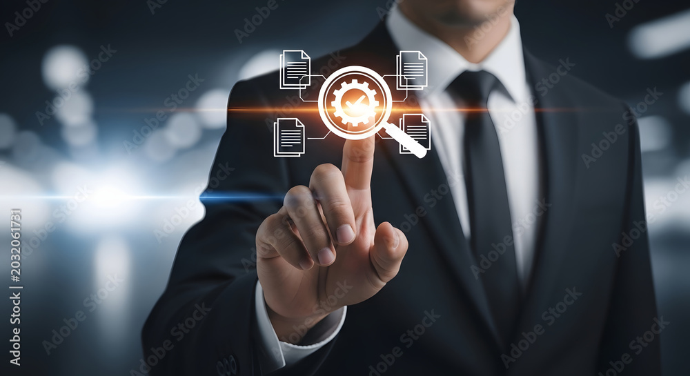 Fototapeta premium Businessman touching magnifying glass with gear and document icons on screen hand