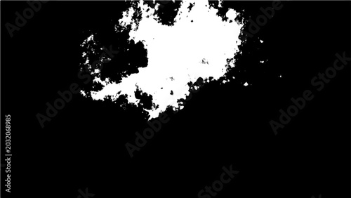 Photos Abstract white explosion or burst against a stark black background, evoking a se
