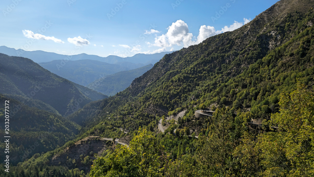Obraz premium Route des Grandes Alpes M70 winding through french mountains near Col de Turini, Maritime Alps, France, Europe.