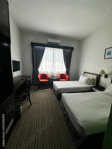 Standard Twin Bedroom Setup in Modern Hotel