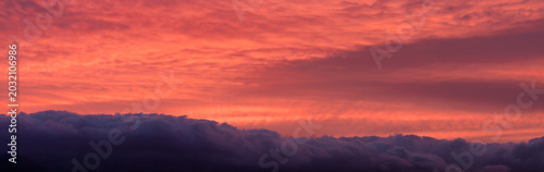 Dramatic Red Sunset Sky Over Dark Clouds Panorama