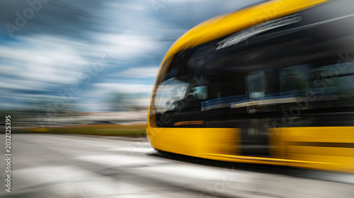 Canvastavla Modern Tram Rushes With Motion Effect On A Street At Fast Speed