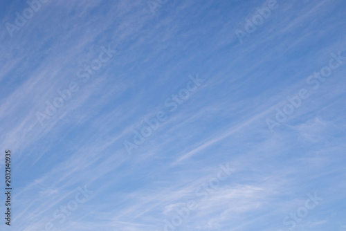 Thin diagonal white clouds in a blue sky over southern Africa image for background use
