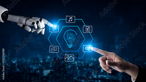 Фотография A captivating scene showing the interaction between a human hand and a robotic hand, surrounded by AI-related icons in a digital landscape, symbolizing innovation and technology