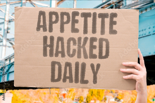 Bild auf Leinwand "Appetite Hacked Daily" Processed food companies reprogram hunger every meal