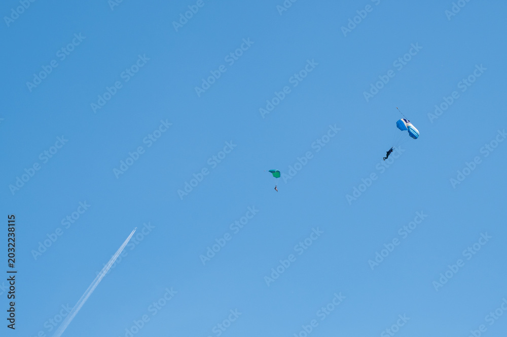 Fototapeta premium Paragliding adventure in blue sky