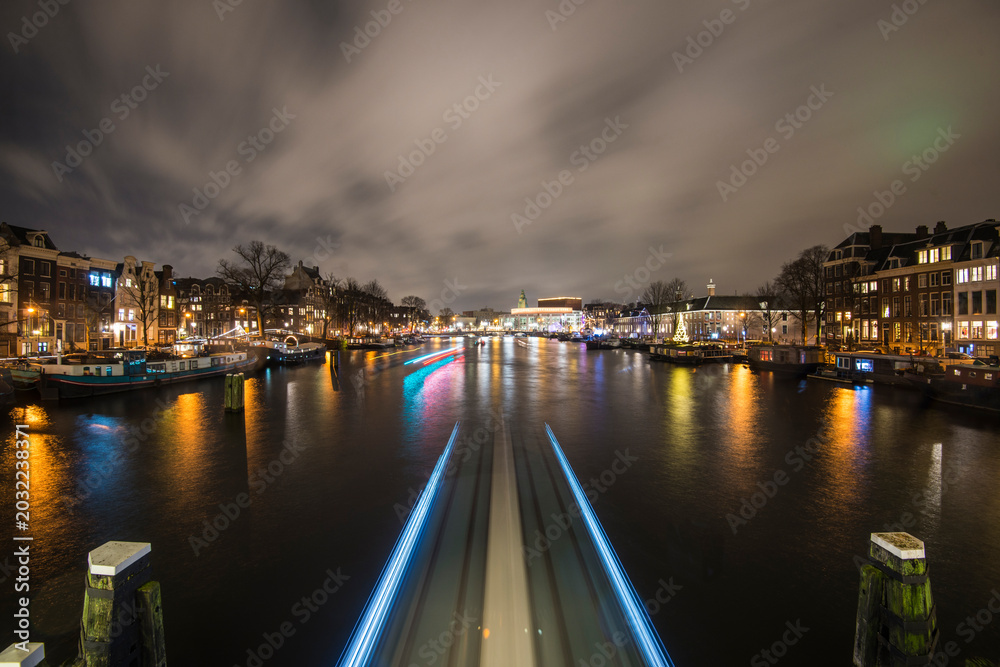 Fototapeta premium Amstel River Light Trails from the Blauwbrug at Night, Amsterdam
