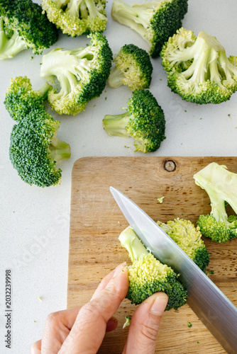 Top View of Cutting Broccoli on a Wooden Board