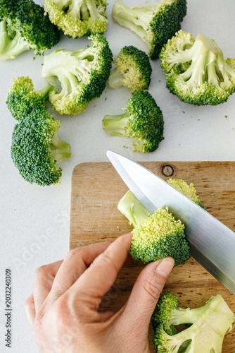 Top View of Cutting Broccoli on a Wooden Board