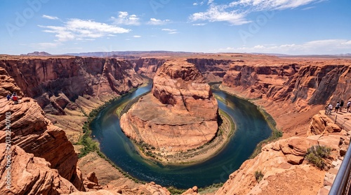 Konstfotografi Horseshoe bend features a dramatic and winding river carved through deep red desert sandstone canyons under a bright blue sky captured in this wide angle landscape photo of natural wonder