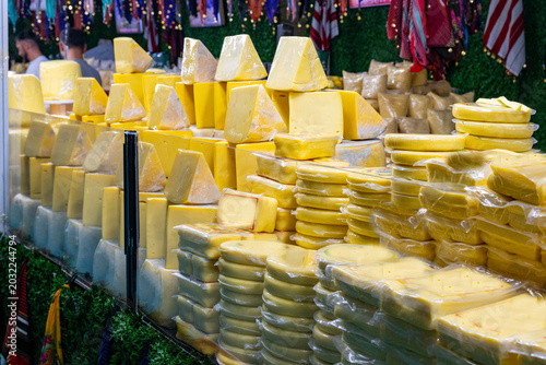 Various Turkish cheese on in diary production market. A lot of kind Turkish cheese  wheels on the shelves in diary production market. Food. Organic fresh chee se  skin and blocks of raw  in stainless 