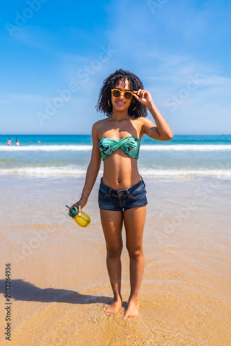 Young woman enjoying tropical beach vacation leisure