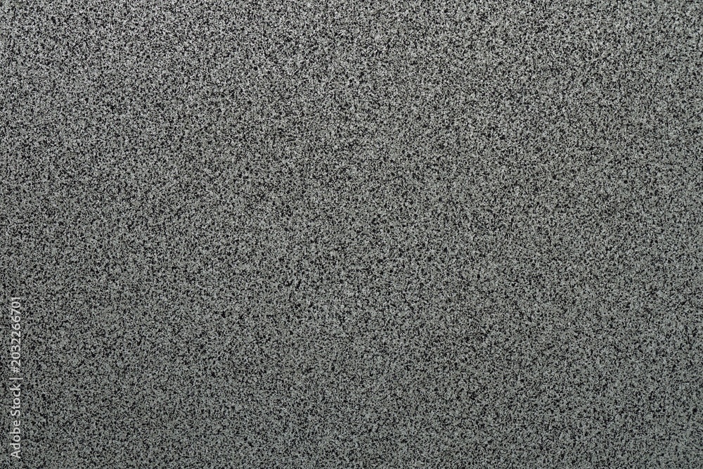 Fototapeta premium Detailed view on terrazzo cement background with small black and white stone grains