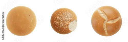 Three different fresh bread rolls and burger buns viewed from above isolated on a white background