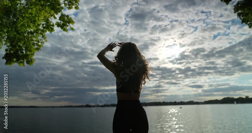 Feeling completely free and alive by the water A stunning and captivating silhouette