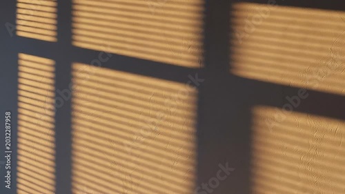 A close-up view of a window with blinds in an industrial setting