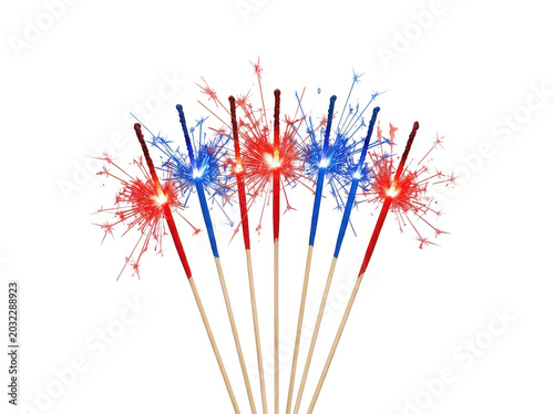 Vibrant red, white, and blue sparklers lit up on wooden sticks against a white background