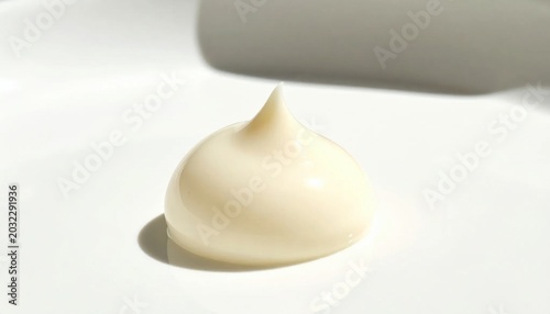 Isolated dollop of creamy white cosmetic lotion or face cream, smooth texture, skincare product sample, skincare routine, beauty ingredient, dermatology
