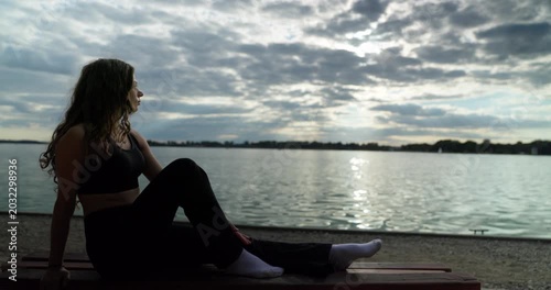 A Thoughtful Contemplative Moment by the Water Beneath the Overcast and Cloudy Skies