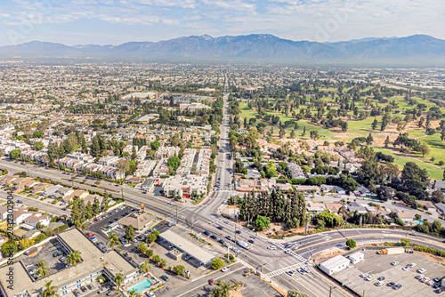 
Rosemead, California CA September 6, 2024: High Aerial City Drone View toward San Gabriel Blvd, Walnut Grove Ave, Whittier Narrows BMX, Los Angeles Rifle and Revolver Club, Golf Courses with Mountain