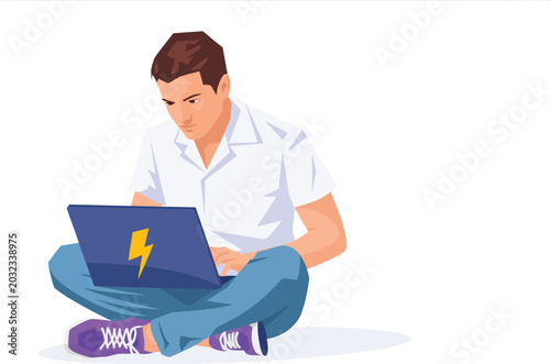 Young man sitting on floor using a laptop computer