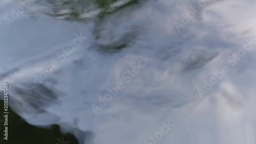 Closeup of koi fish swimming in a pond, relieves stress, lowers blood pressure, and slows heart rate. Mental relaxation
