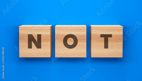 Fotografie Wooden Blocks Spelling NOT on Blue Background