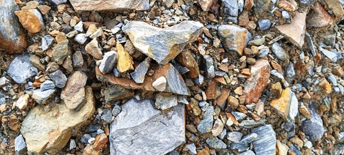 Photos A large river stone protecting smaller pebbles underneath