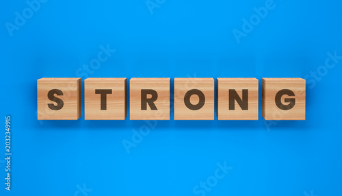 Bilde på lerret The Word STRONG: Six wooden blocks with the letters spelling STRONG are neatly arranged on a vibrant blue background, symbolizing resilience and power